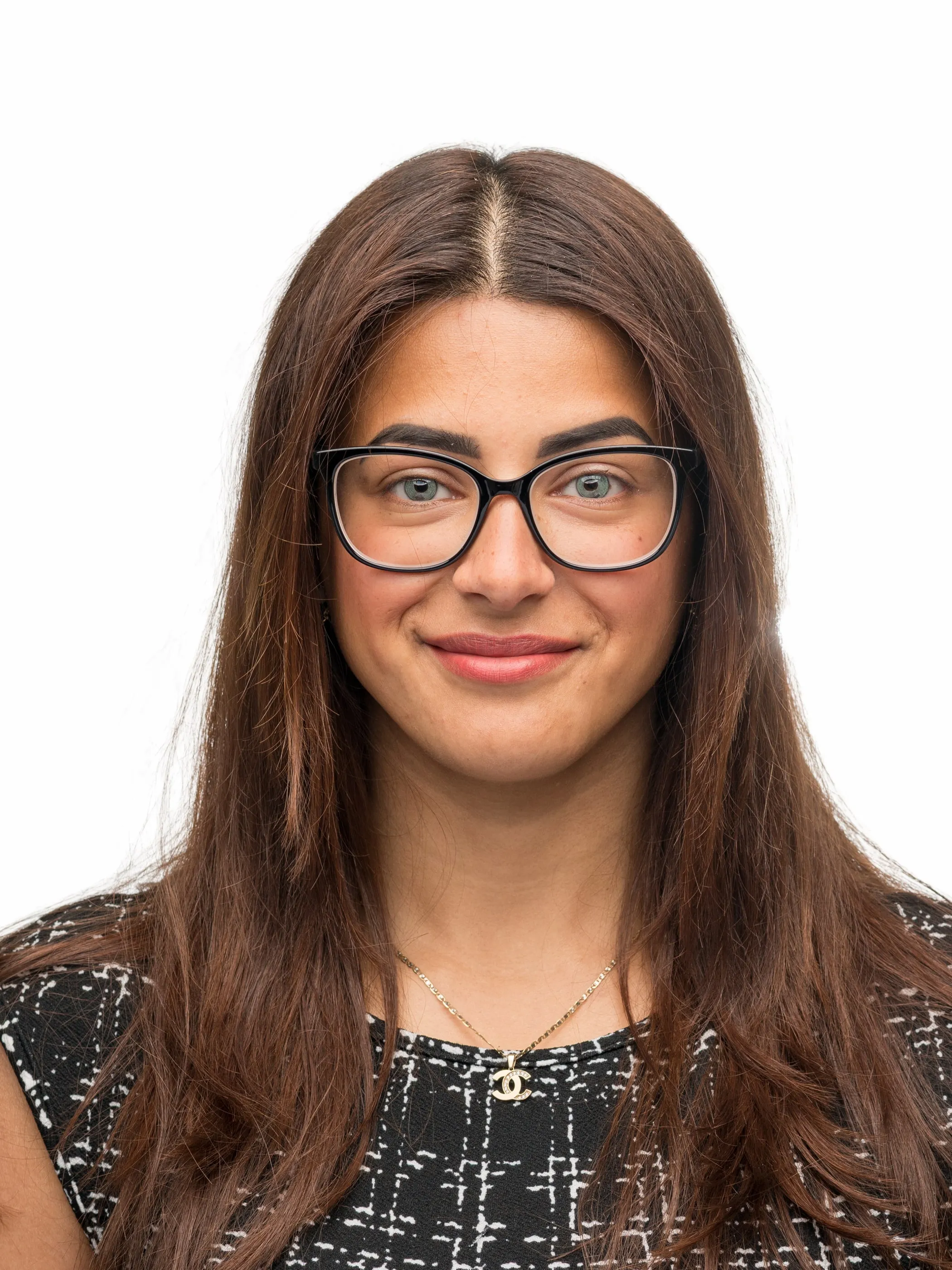 Corporate headshot of a woman in glasses on a white background