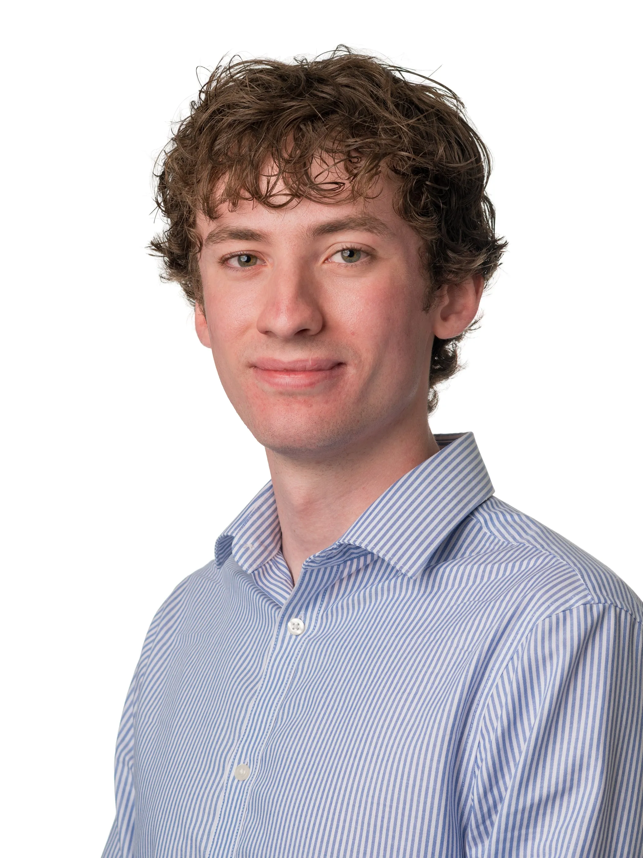 Corporate headshot of a man in a blue shirt on a white background