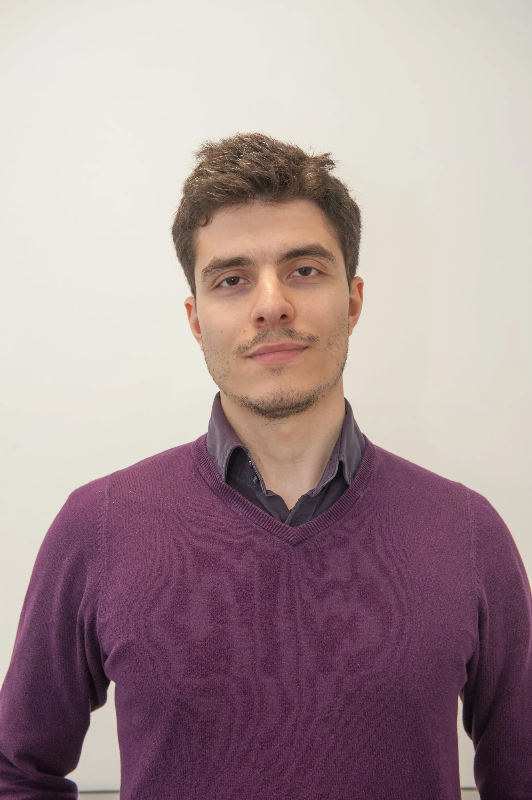 A researcher photographed in the greenhouse where they work